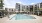 Pool with apartment in background