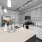 Spacious and well lit kitchen with wood flooring and stainless steel appliances