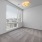 Large well lit bedroom with plush carpets and large windows 