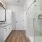 spacious bathroom with granite countertops and glass shower