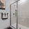 Large well lit bathroom with white accents 