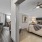 Large well lit bedroom with plush carpets and large windows 