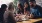 a group of people eating at a table